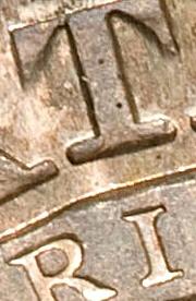 i shade right of center of t 1827 capped bust half dollar